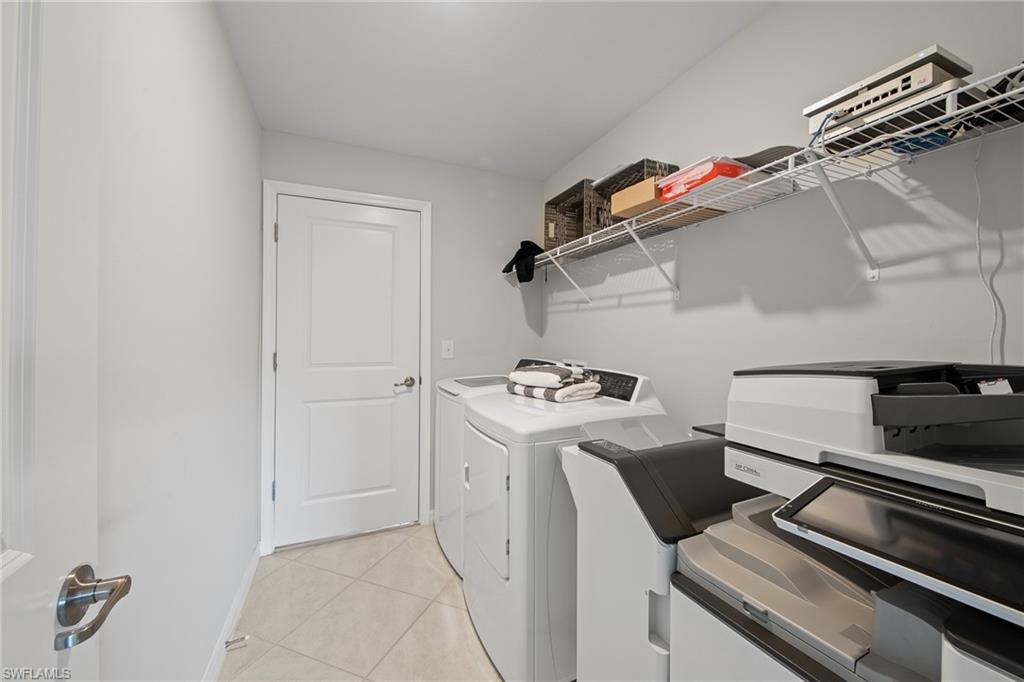 4139 Tulia Way North Fort Myers, FL 33917 - Photo 26 of 32 a storage room with washer and dryer