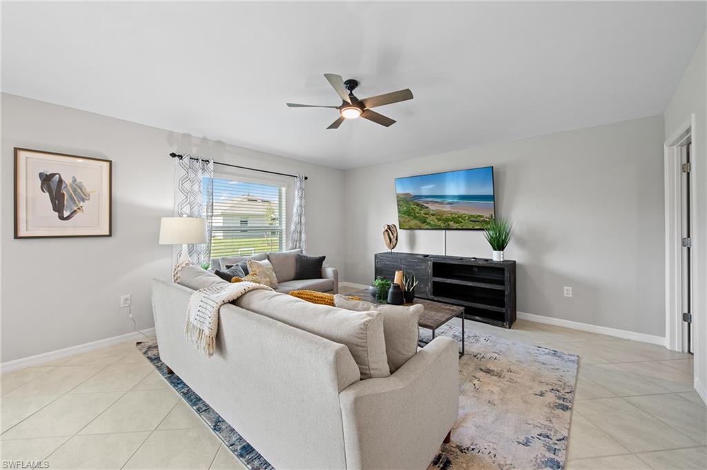 4139 Tulia Way North Fort Myers, FL 33917 - Photo 7 of 32 a living room with furniture and a window