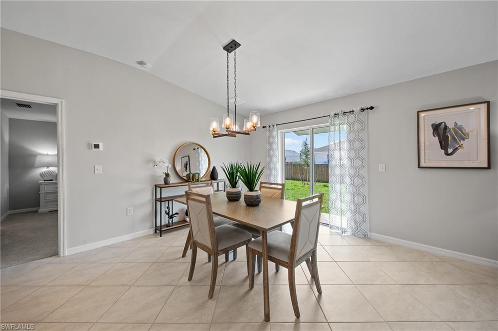 4139 Tulia Way North Fort Myers, FL 33917 - Photo 10 of 32 a dining room with furniture and window