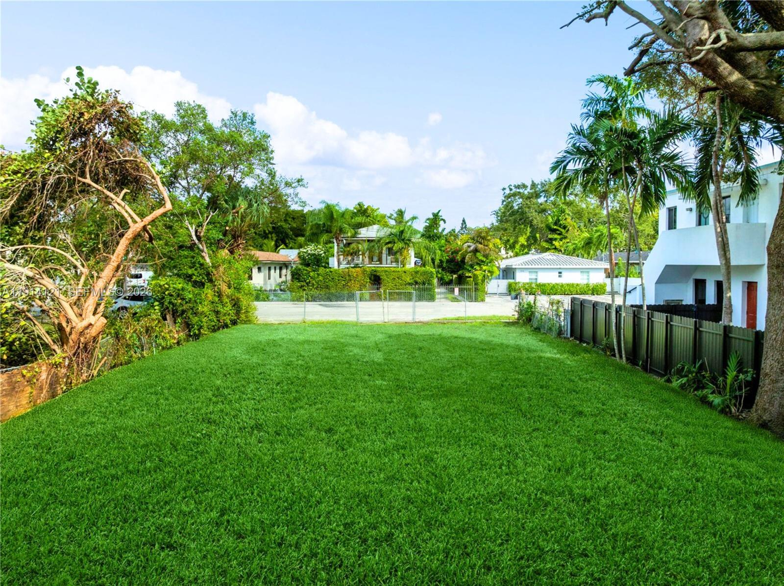 508 Northeast 67th Street Miami, FL 33138 - Photo 11 of 27 a view of an house with backyard and a garden