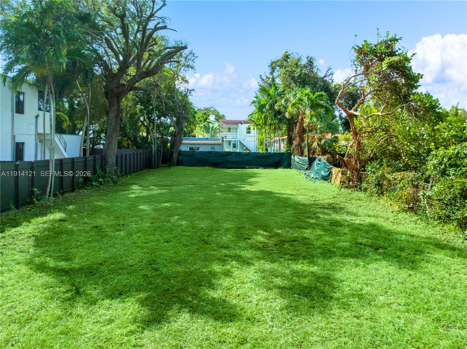 508 Northeast 67th Street Miami, FL 33138 - Photo 12 of 27 a view of yard with grass and trees