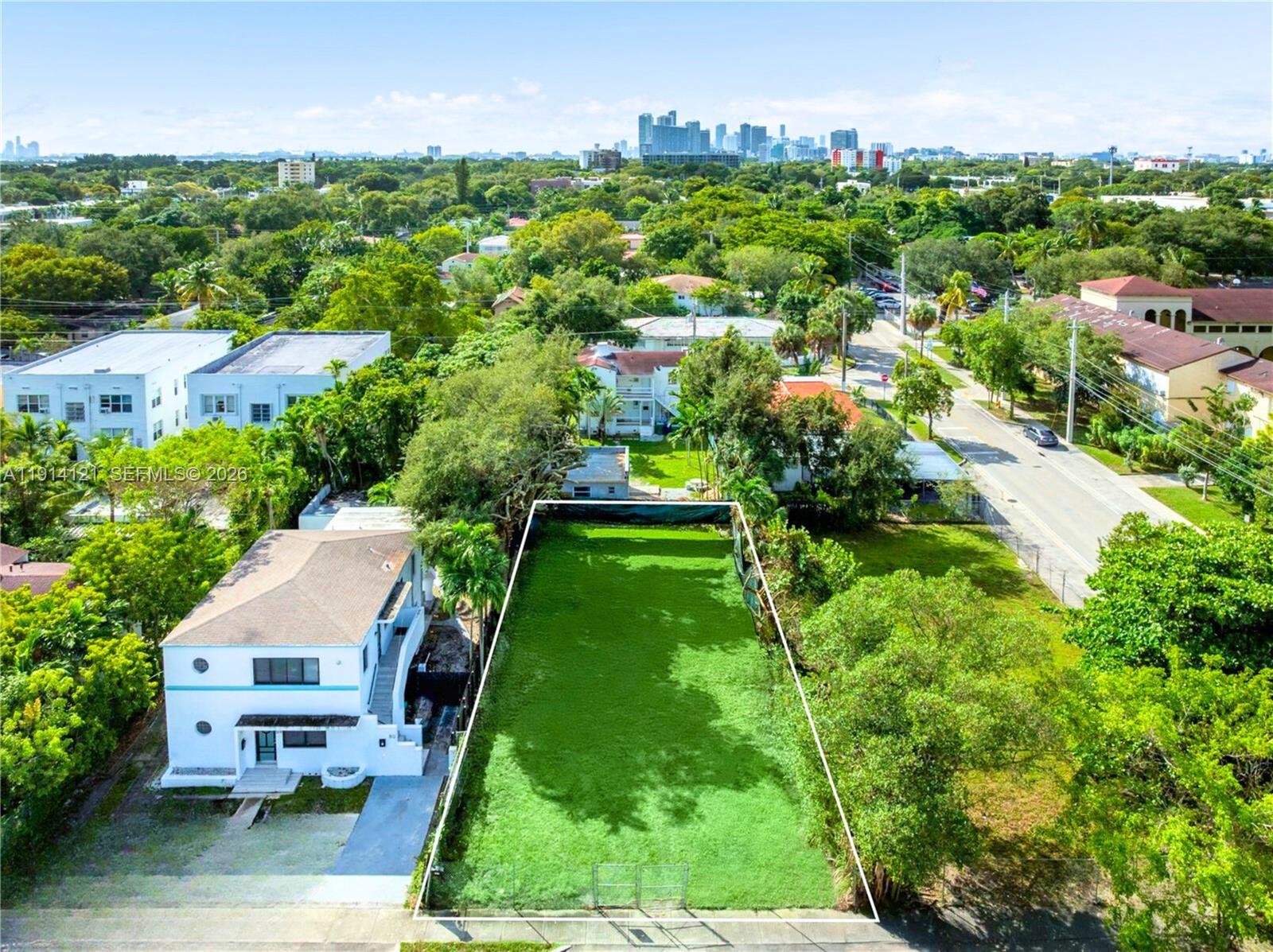 508 Northeast 67th Street Miami, FL 33138 - Photo 7 of 27 an aerial view of residential houses with outdoor space and trees all around