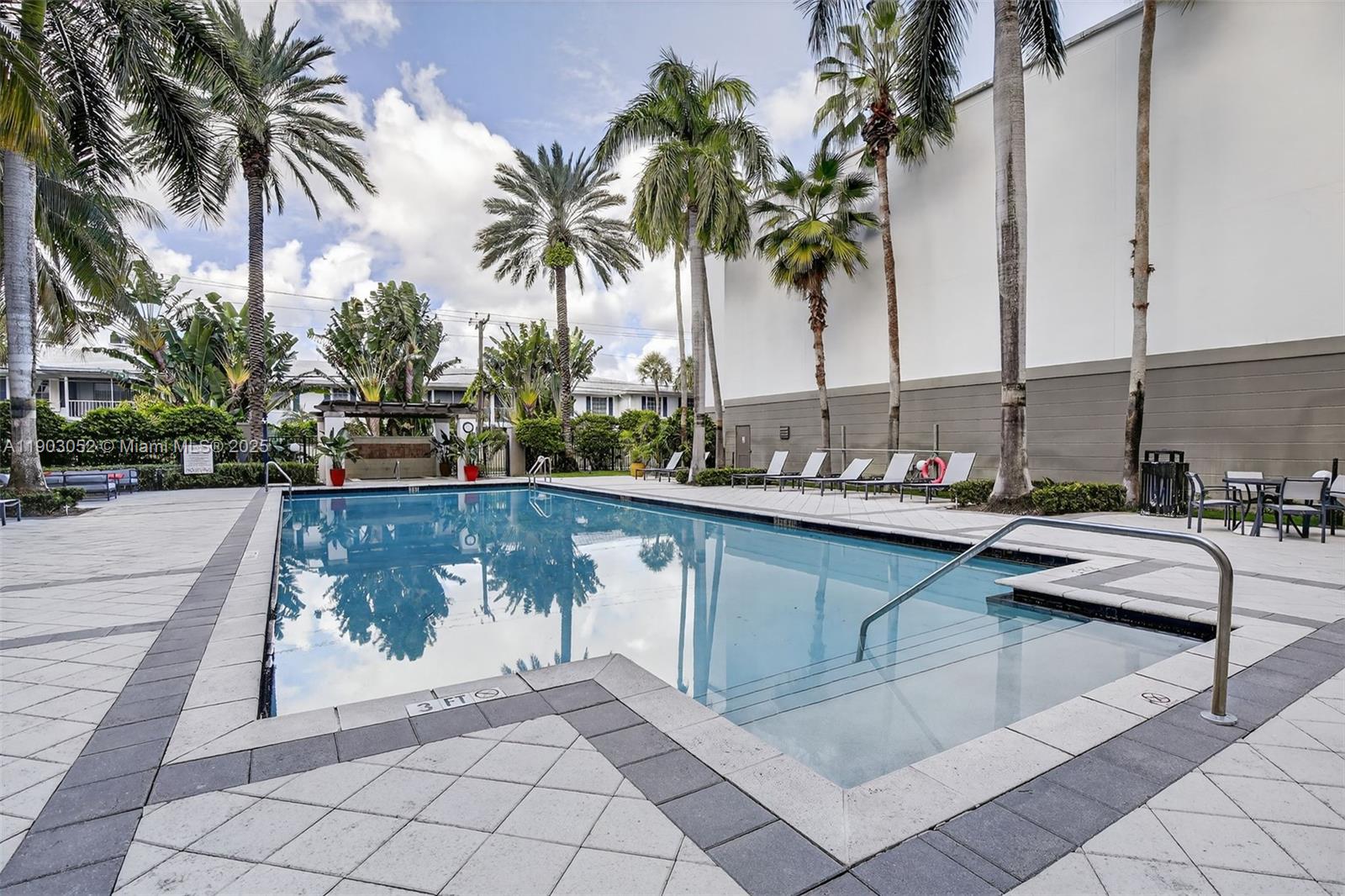 2421 Northeast 65th Street, Unit 508 Fort Lauderdale, FL 33308 - Photo 20 of 29 a view of swimming pool with chairs
