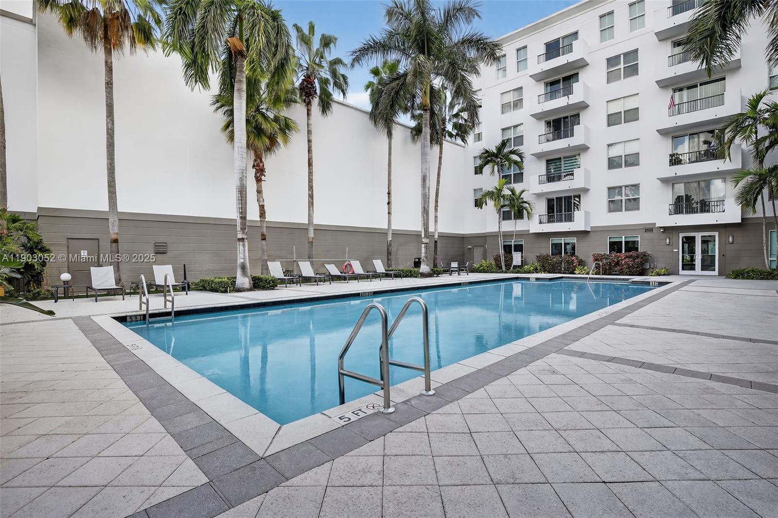 2421 Northeast 65th Street, Unit 508 Fort Lauderdale, FL 33308 - Photo 22 of 29 a view of swimming pool with outdoor seating and plants