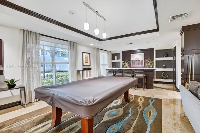 a room with furniture and a flat screen tv