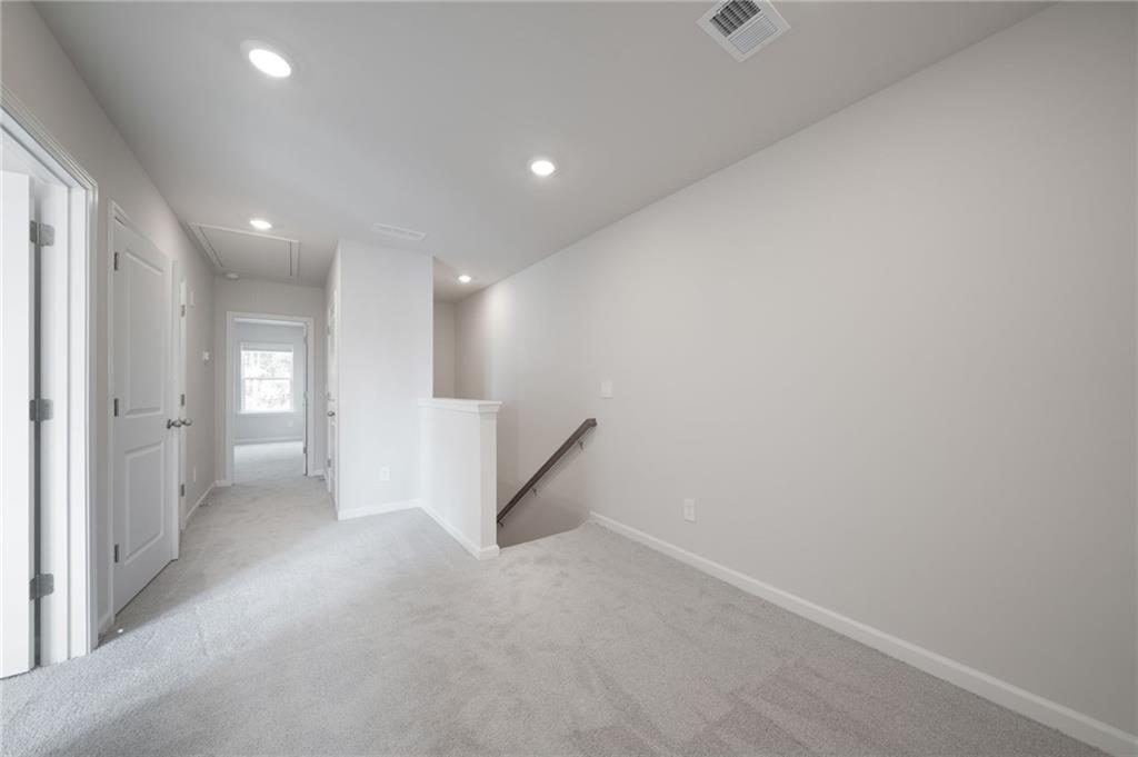 7830 Marie Way Fairburn, GA 30213 - Photo 15 of 30 an empty room with a empty space and windows