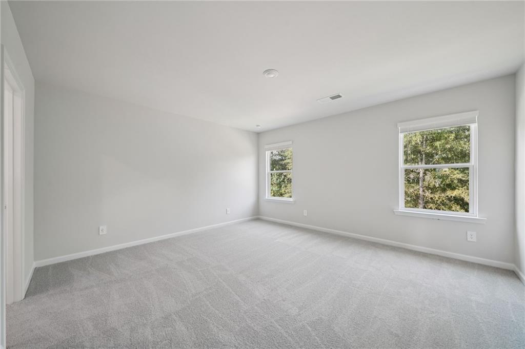 7830 Marie Way Fairburn, GA 30213 - Photo 16 of 30 an empty room with windows