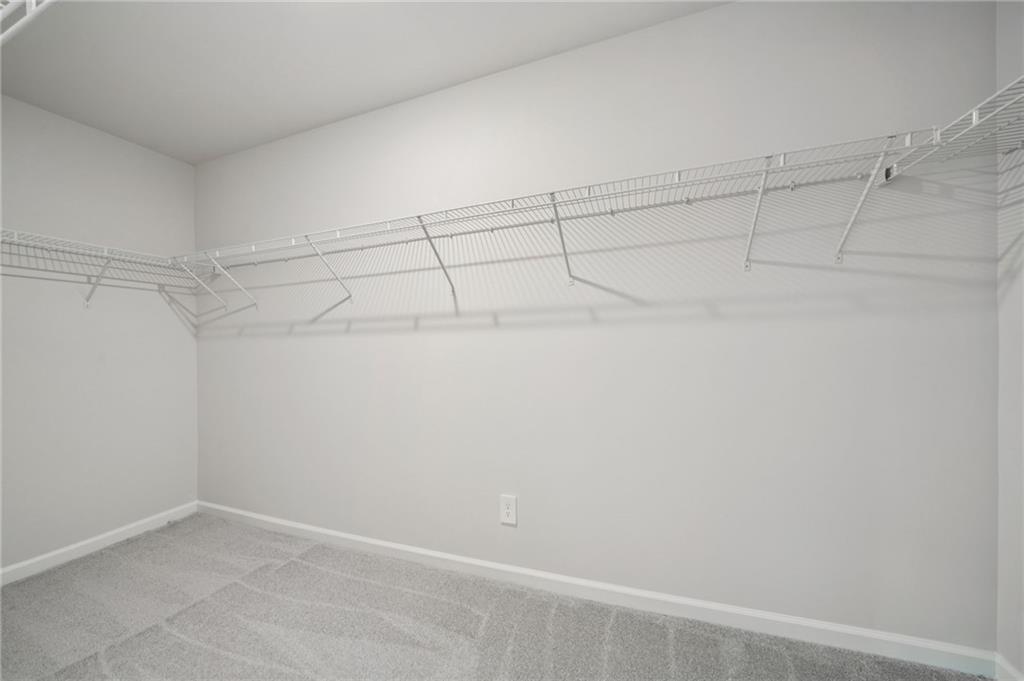7830 Marie Way Fairburn, GA 30213 - Photo 19 of 30 a view of a room with racks on the wall