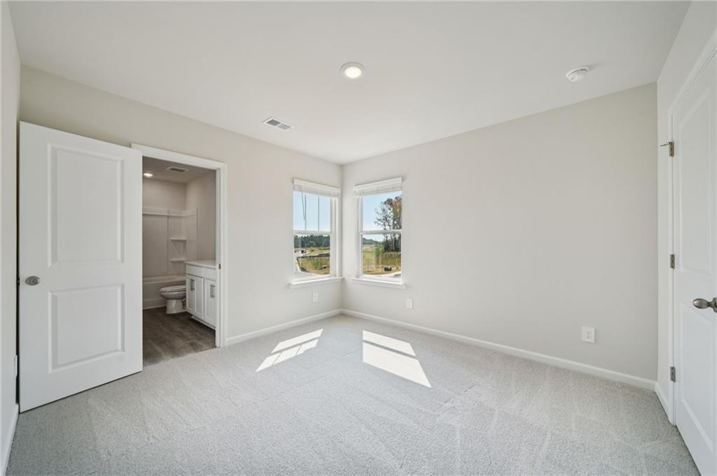 7830 Marie Way Fairburn, GA 30213 - Photo 21 of 30 a view of an empty room with a window