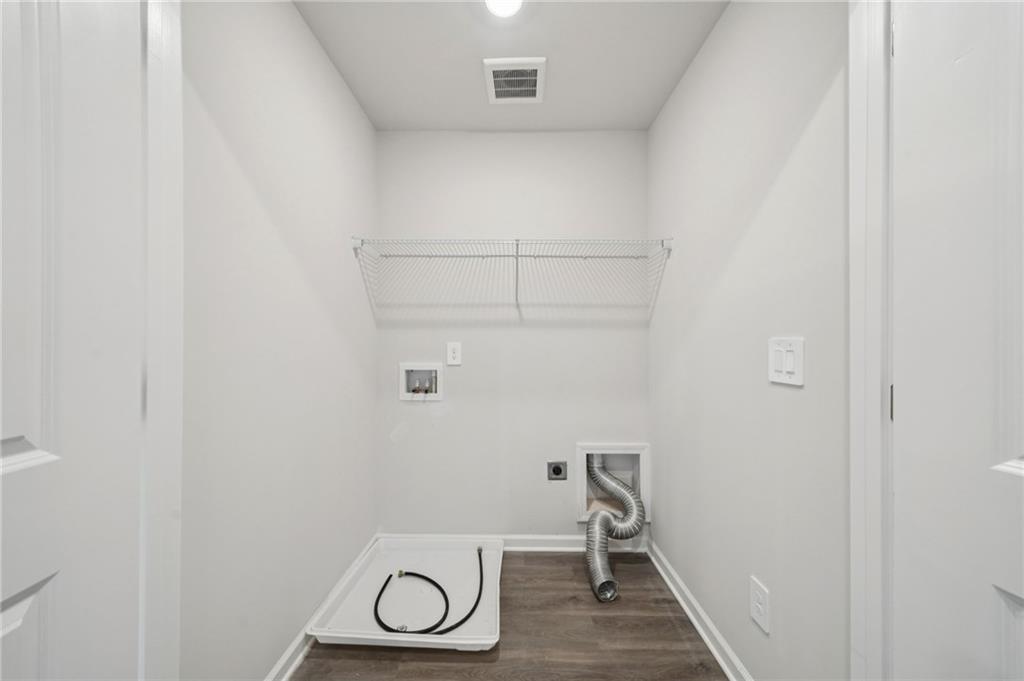 7830 Marie Way Fairburn, GA 30213 - Photo 26 of 30 a bathroom with a sink and a toilet