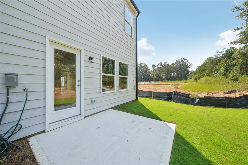 7830 Marie Way Fairburn, GA 30213 - Photo 27 of 30 a view of an outdoor space and a yard