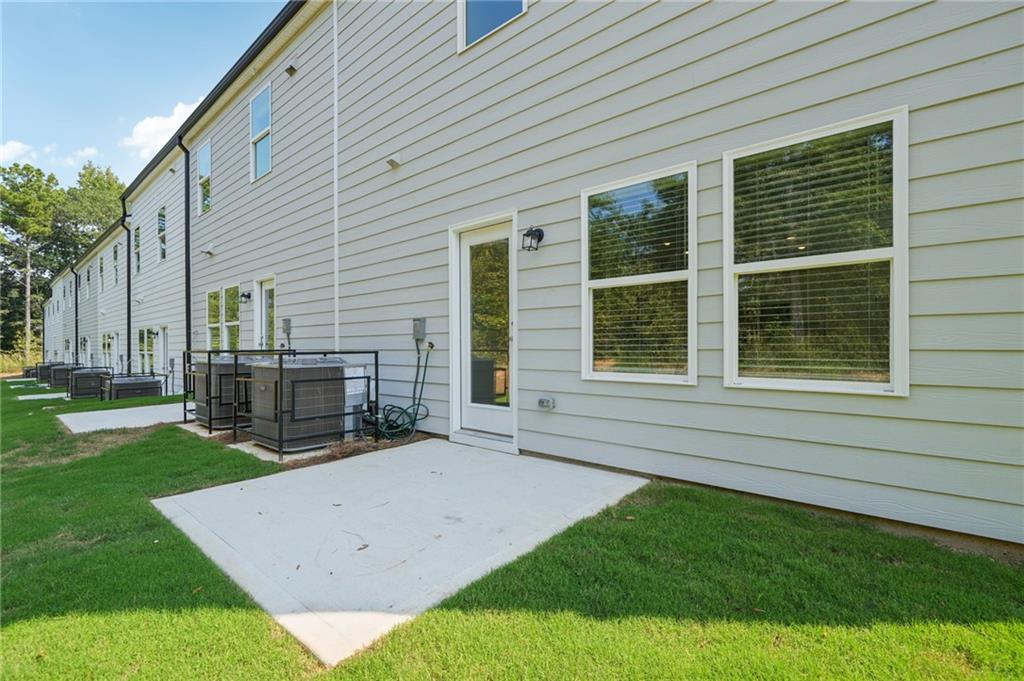 7830 Marie Way Fairburn, GA 30213 - Photo 28 of 30 a view of a house with a backyard