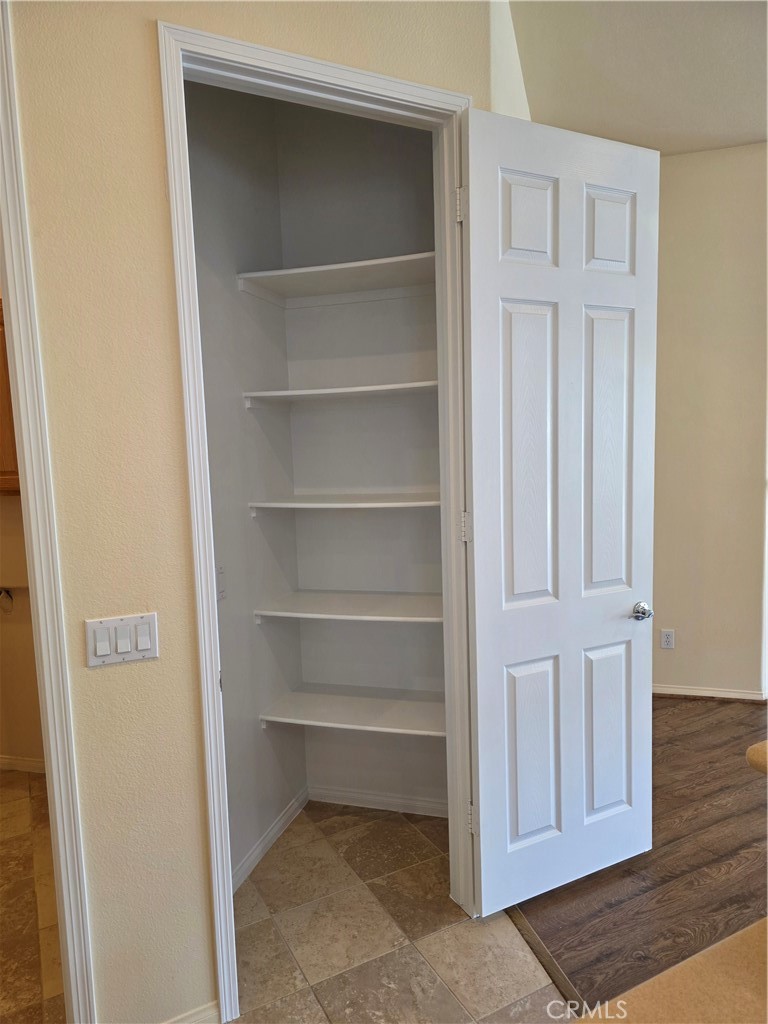 924 Brentwood Road Beaumont, CA 92223 - Photo 13 of 41 a view of a room with rack on the wall