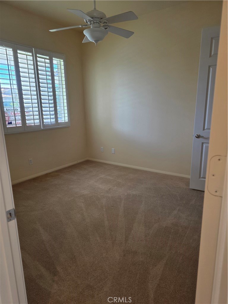 924 Brentwood Road Beaumont, CA 92223 - Photo 21 of 41 an empty room with a window