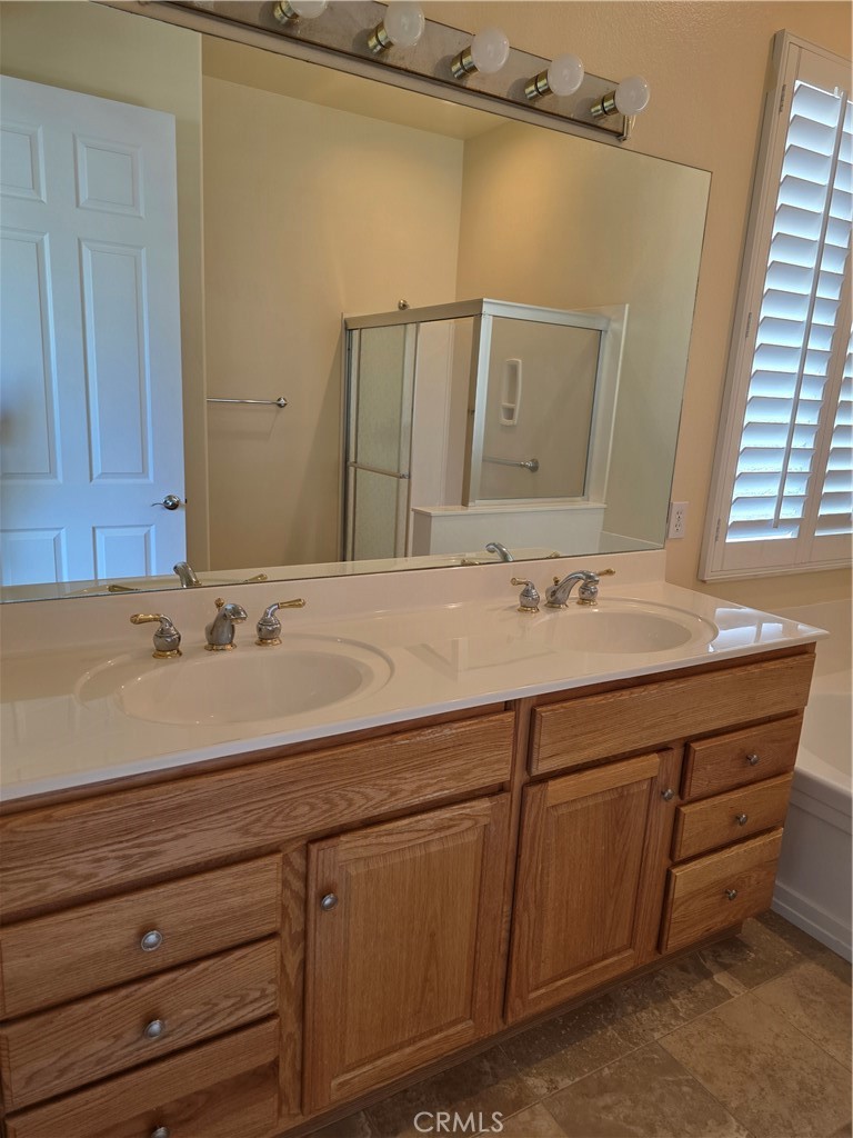 924 Brentwood Road Beaumont, CA 92223 - Photo 26 of 41 a bathroom with a sink and a mirror