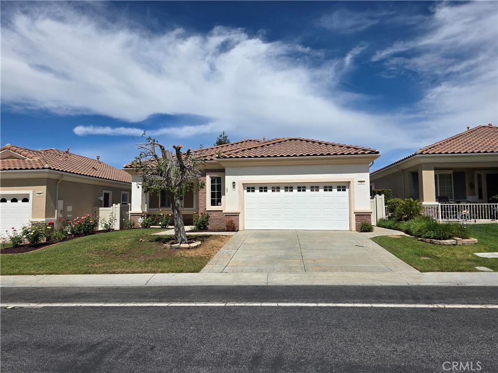 924 Brentwood Road Beaumont, CA 92223 - Photo 3 of 41 a view of a house with a garden