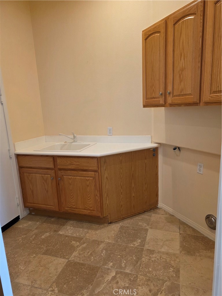 924 Brentwood Road Beaumont, CA 92223 - Photo 31 of 41 a room with cabinets