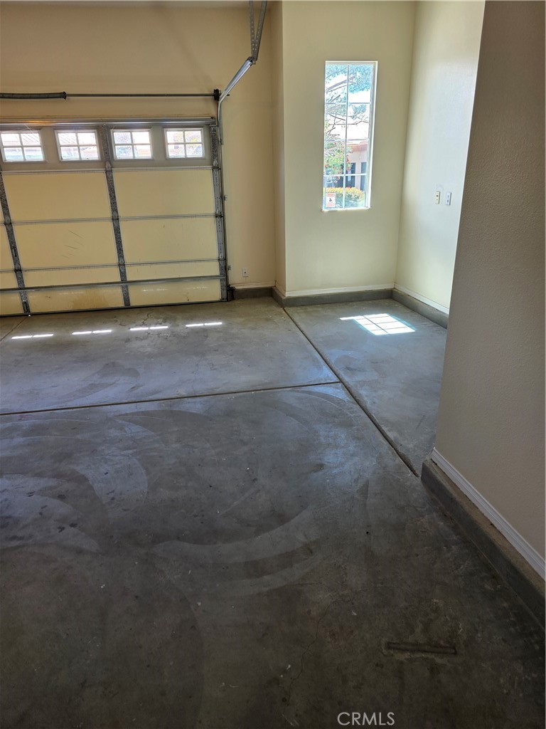 924 Brentwood Road Beaumont, CA 92223 - Photo 33 of 41 an empty room with wooden floor and windows