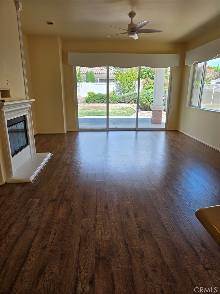 924 Brentwood Road Beaumont, CA 92223 - Photo 5 of 41 wooden floor in an empty room with a window