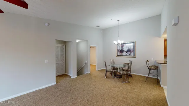 a view of a livingroom with furniture and a window