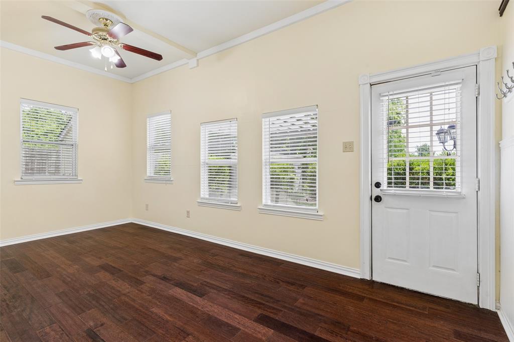 5824 Boone Street Sachse, TX 75048 - Photo 23 of 40 a view of an empty room with wooden floor and a window