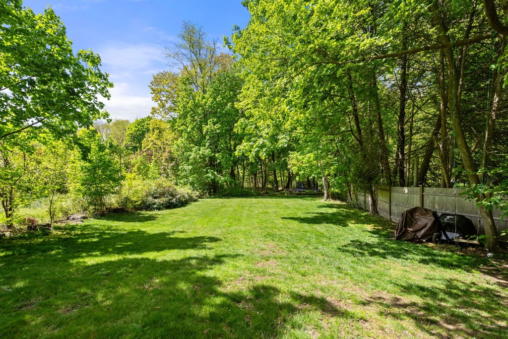 25 Fox Lane Concord, MA 01742 - Photo 17 of 24 a green field with lots of trees in it