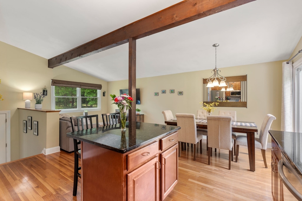 25 Fox Lane Concord, MA 01742 - Photo 2 of 24 a kitchen that has a table chairs in it and wooden floors
