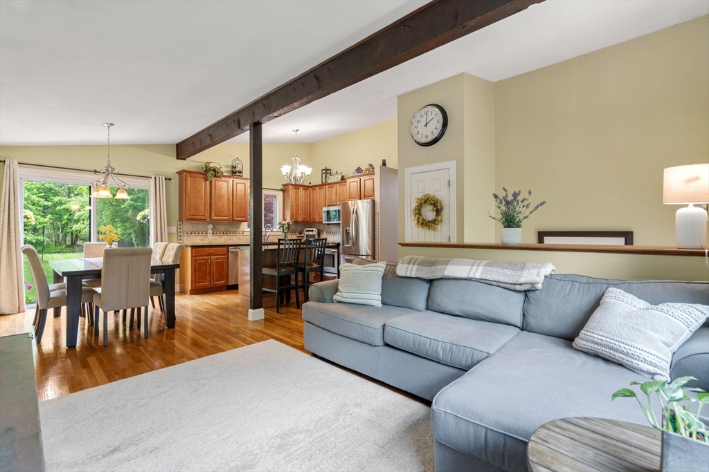 25 Fox Lane Concord, MA 01742 - Photo 6 of 24 a living room with furniture kitchen area and a large window
