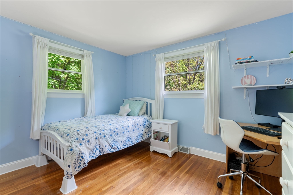 25 Fox Lane Concord, MA 01742 - Photo 7 of 24 a bedroom with a bed and a desk