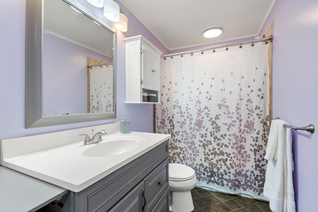 25 Fox Lane Concord, MA 01742 - Photo 10 of 24 a bathroom with a sink toilet and shower