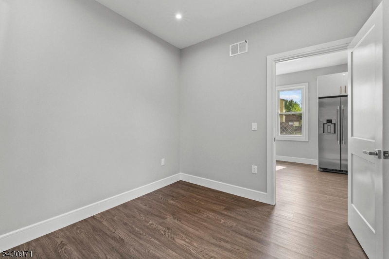 59 Locust Avenue, Unit 1R Wallington, NJ 07057 - Photo 7 of 10 wooden floor in an empty room