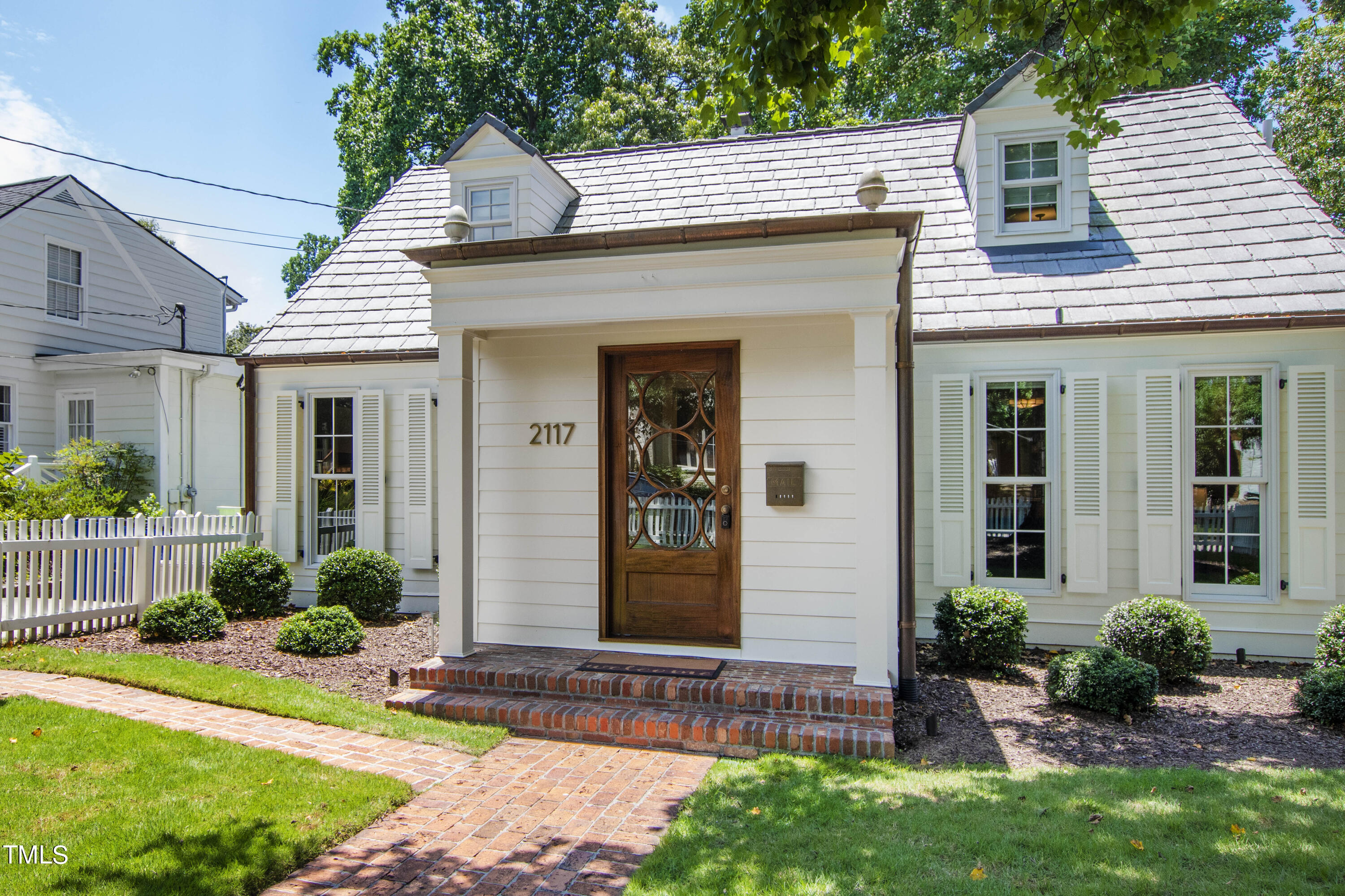 2117 Pine Drive Raleigh, NC 27608 - Photo 2 of 3 a front view of a house with garden