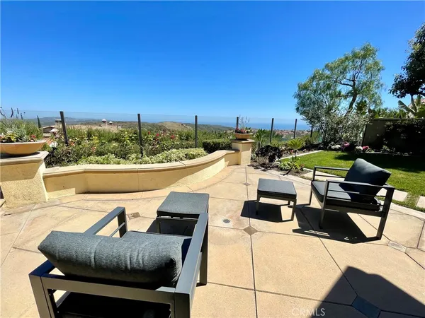 a view of a patio with couches chairs and a table
