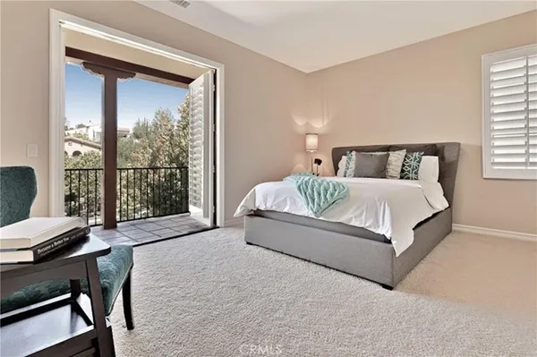 a living room with a bed and a table