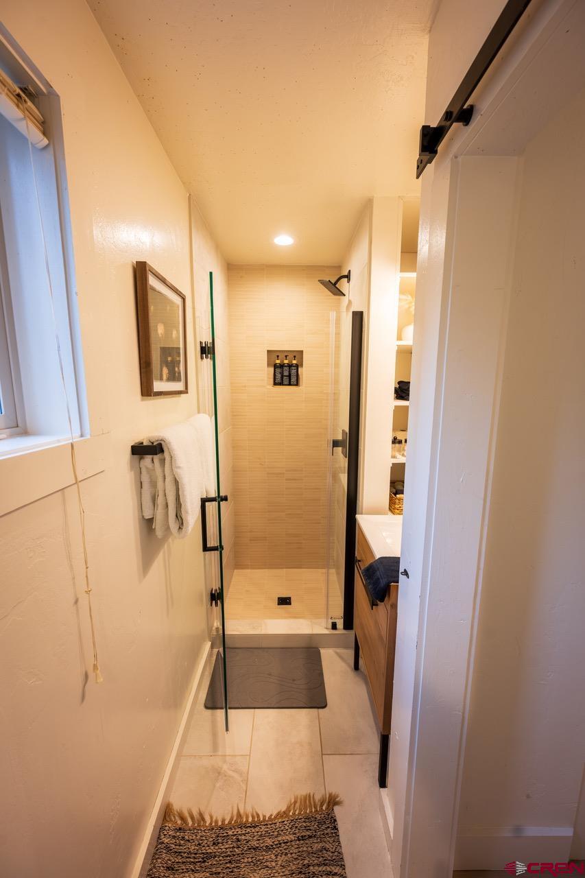 170 Lower Allen Road Crested Butte, CO 81224 - Photo 30 of 42 a bathroom with a tub and shower