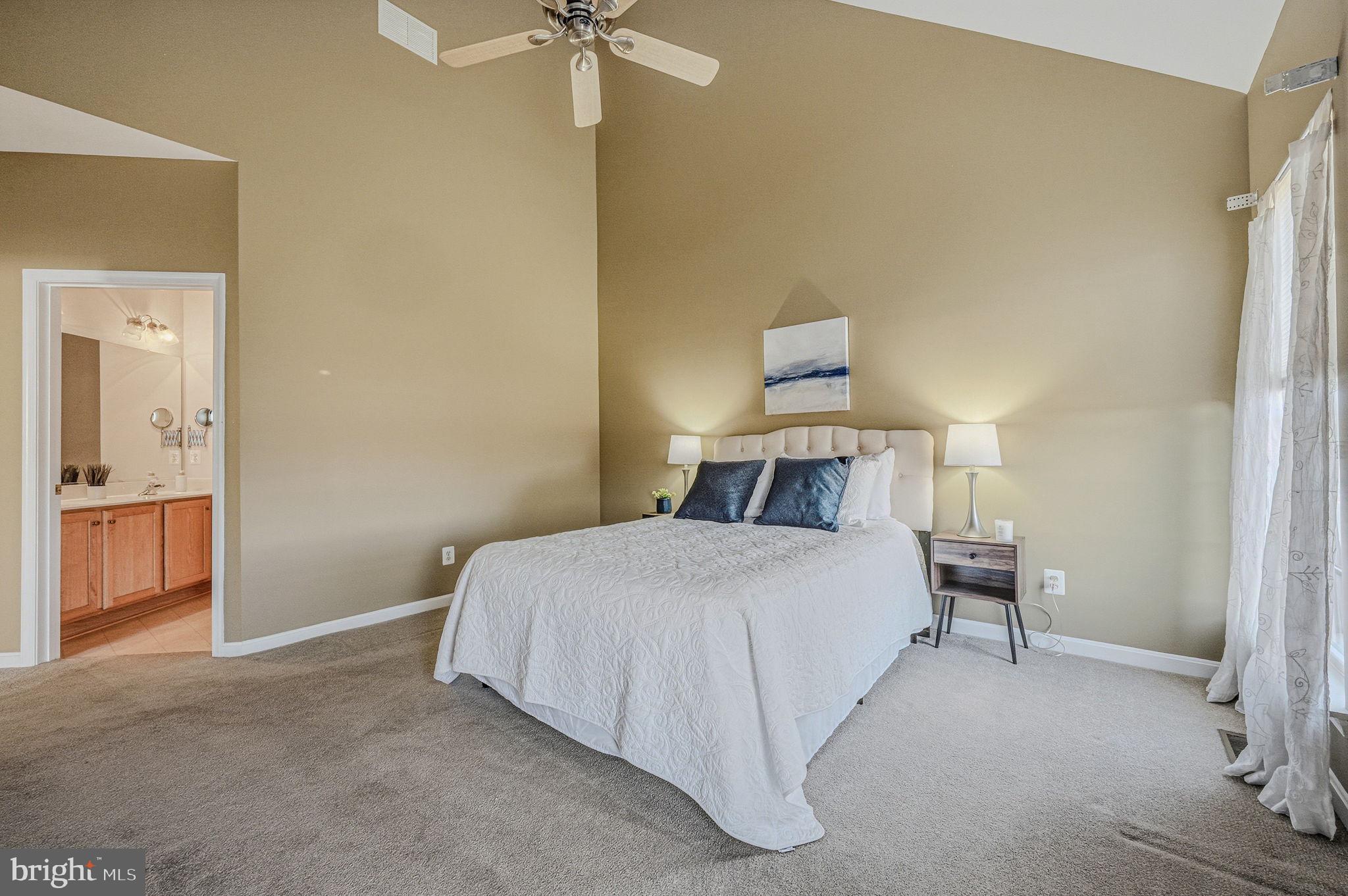 325 Pierce Run Newark, DE 19702 - Photo 19 of 42 a bedroom with a bed and a chandelier