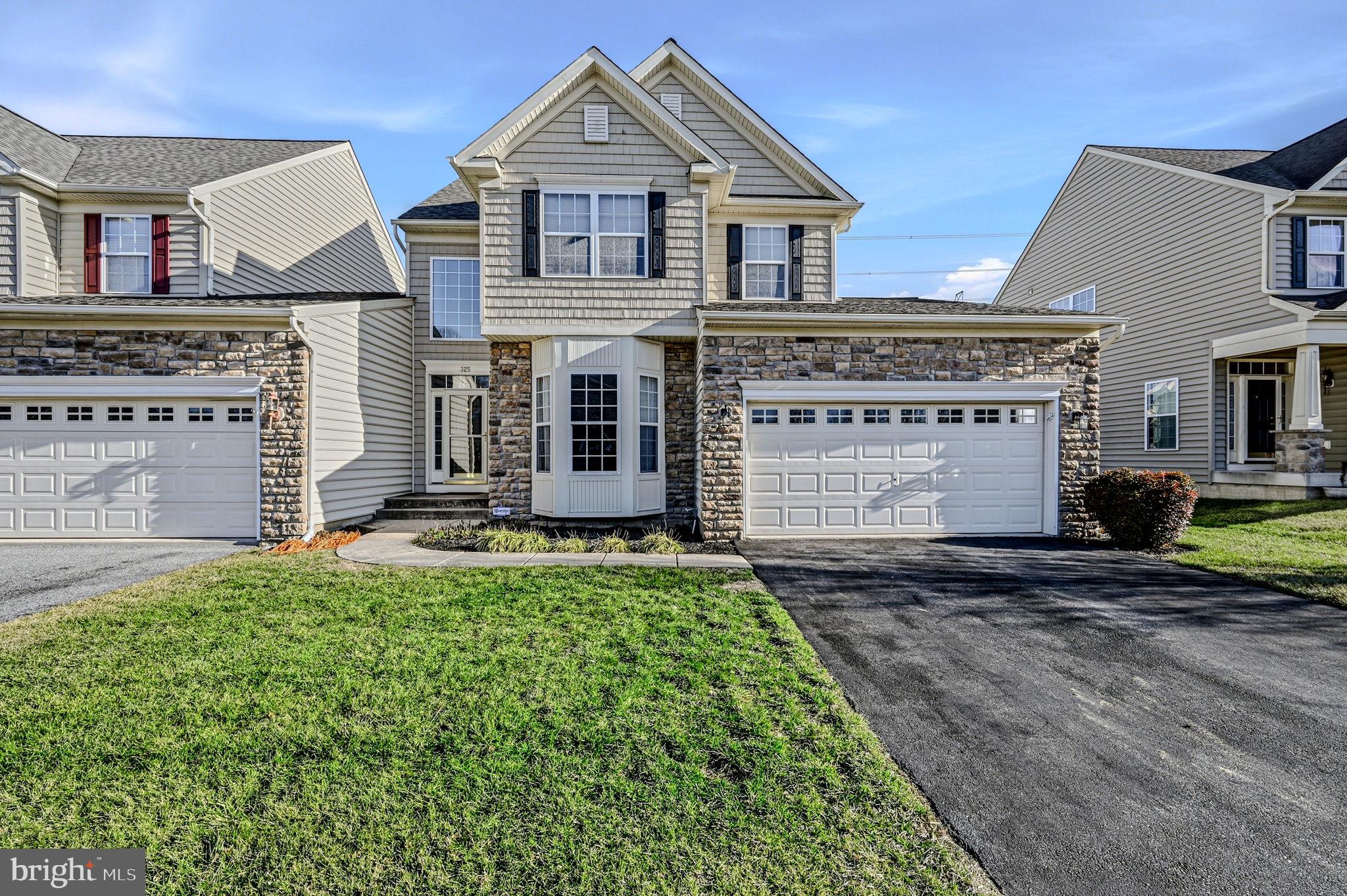 325 Pierce Run Newark, DE 19702 - Photo 2 of 42 a front view of a house with a yard