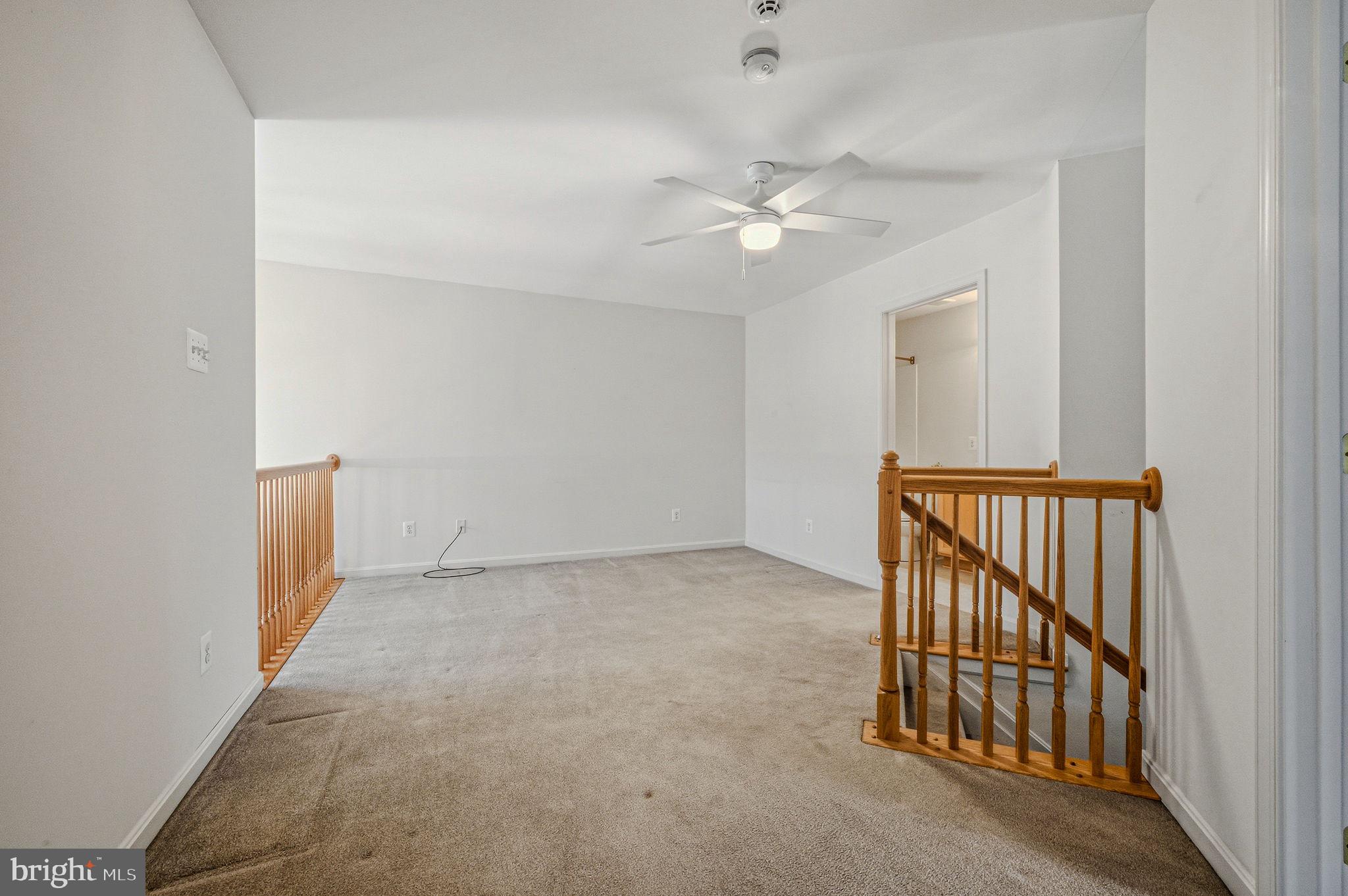 325 Pierce Run Newark, DE 19702 - Photo 25 of 42 an empty room with a chandelier fan