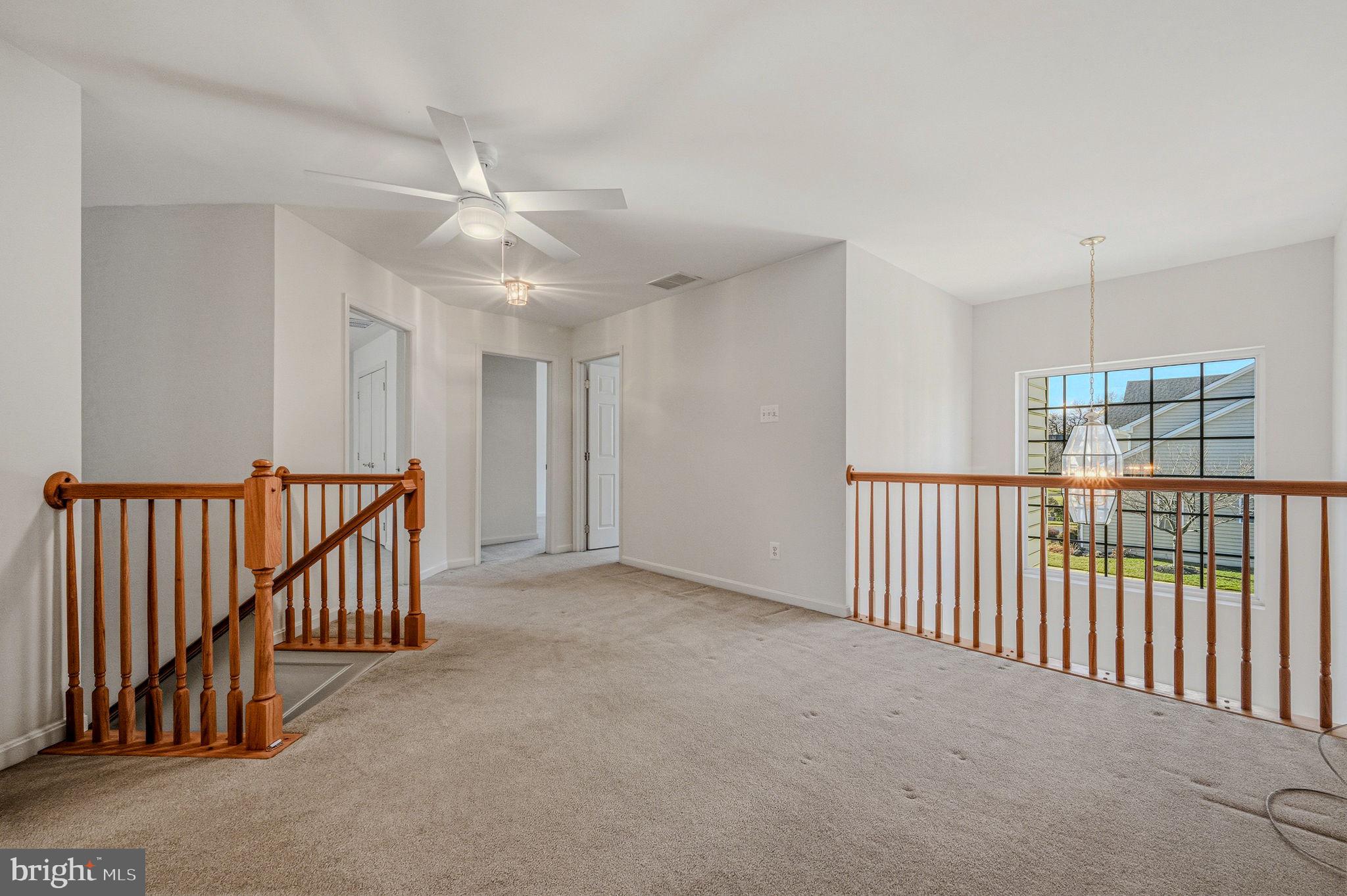 325 Pierce Run Newark, DE 19702 - Photo 26 of 42 an empty room with windows & ceiling fan view