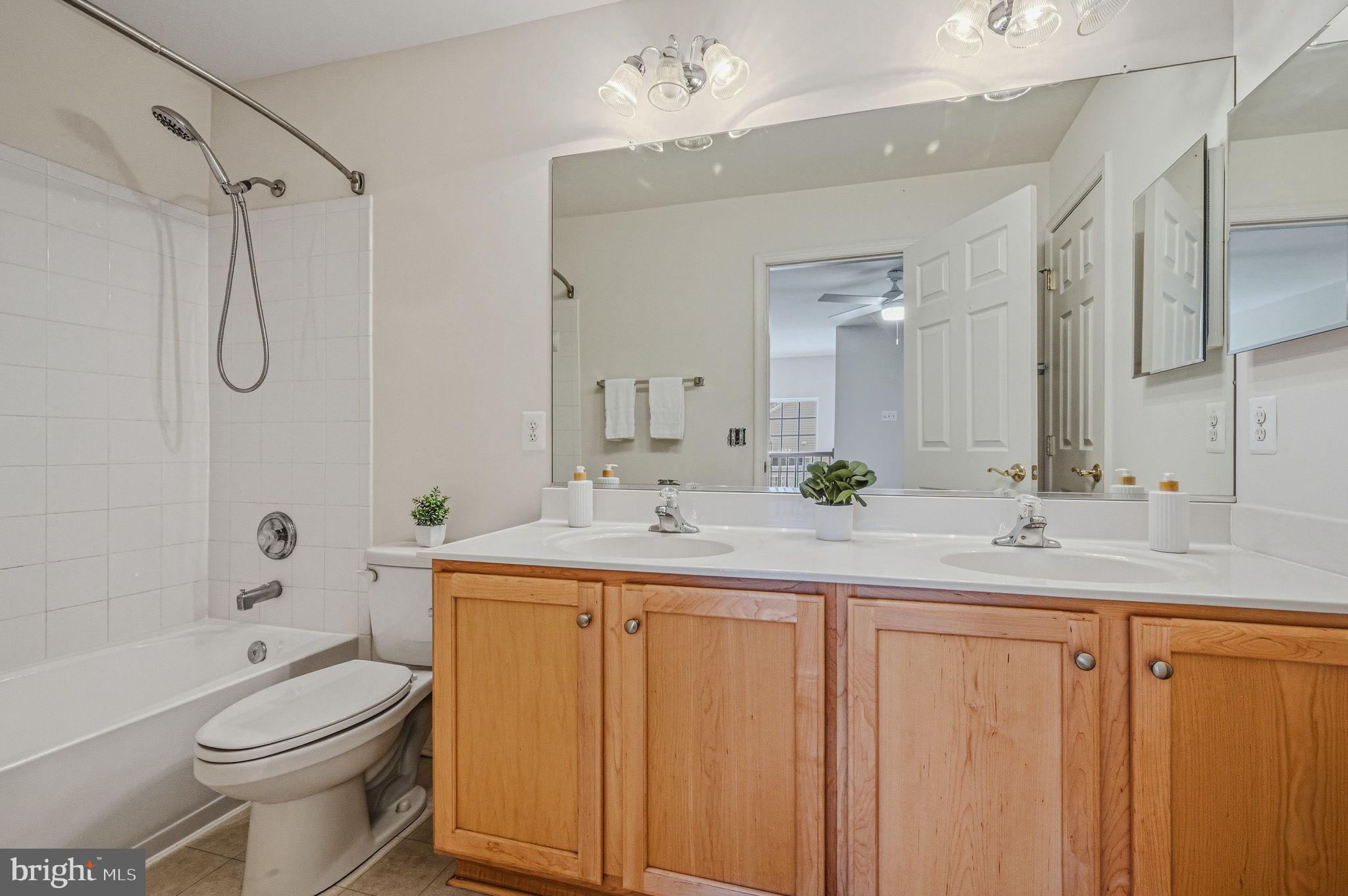 325 Pierce Run Newark, DE 19702 - Photo 27 of 42 a bathroom with a granite countertop sink mirror toilet and bathtub