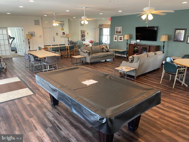 325 Pierce Run Newark, DE 19702 - Photo 39 of 42 a living room with furniture a flat screen tv and kitchen view