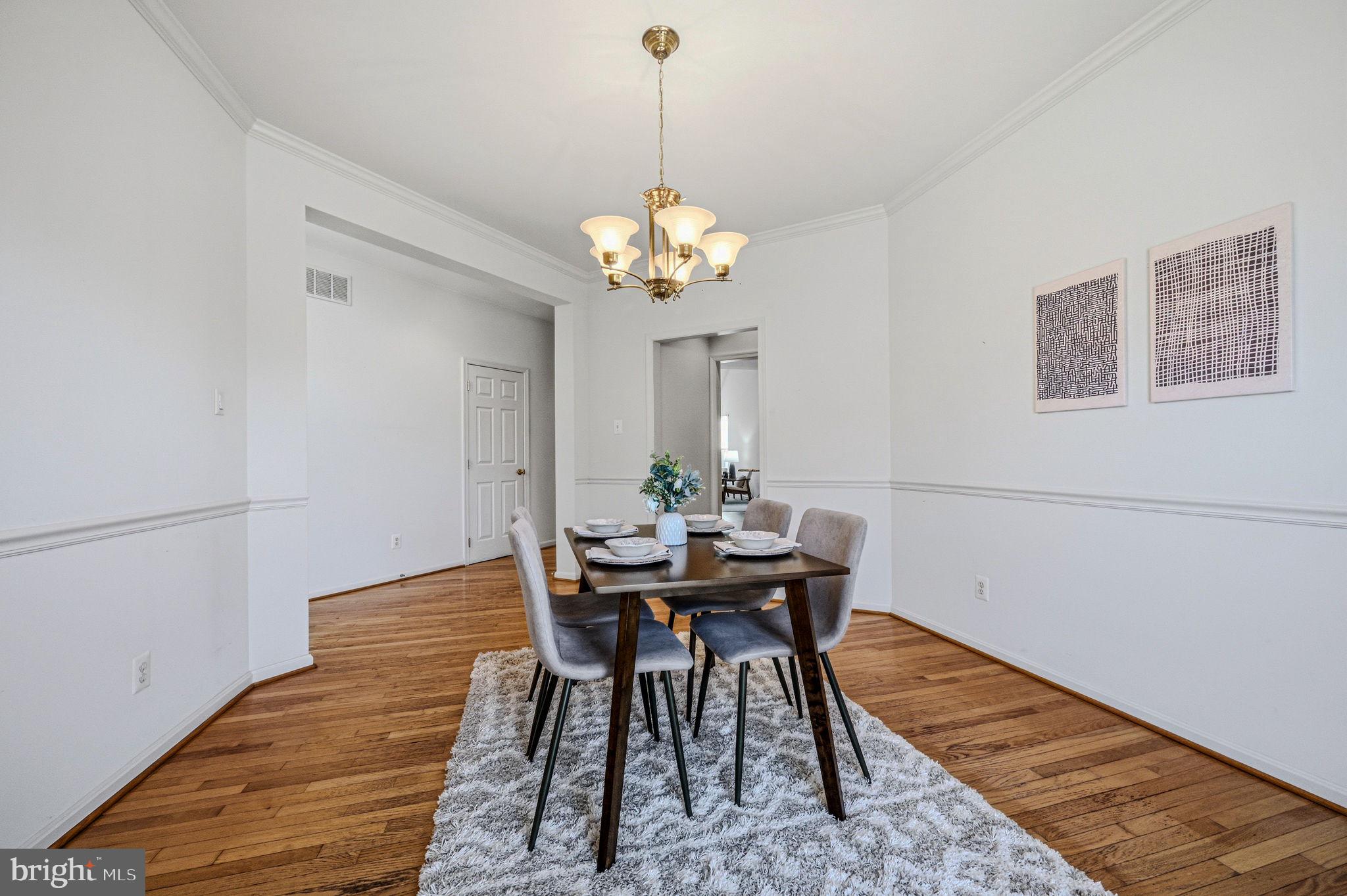 325 Pierce Run Newark, DE 19702 - Photo 6 of 42 a view of a dining room with furniture and wooden floor