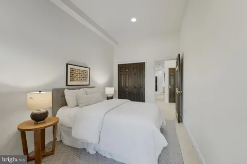 a bedroom with a bed and a lamp