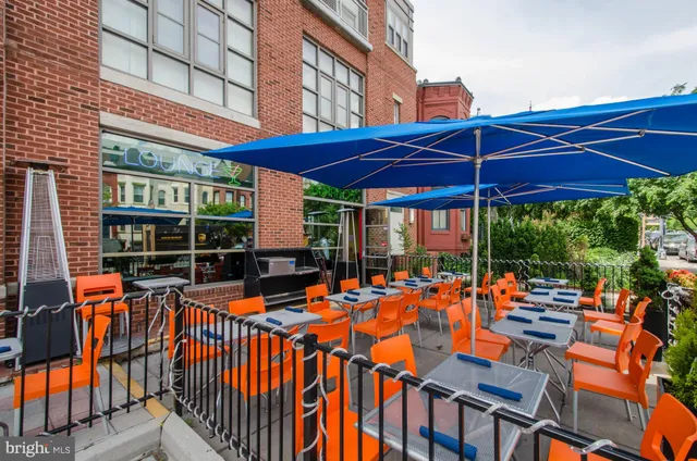 a front view of a building with traffic signal lights