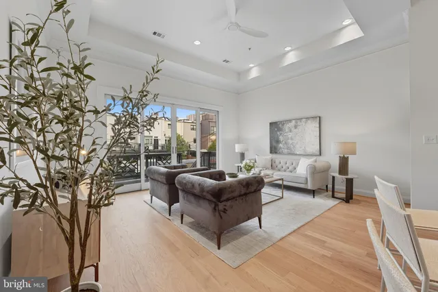 a kitchen with stainless steel appliances a sink stove and cabinets
