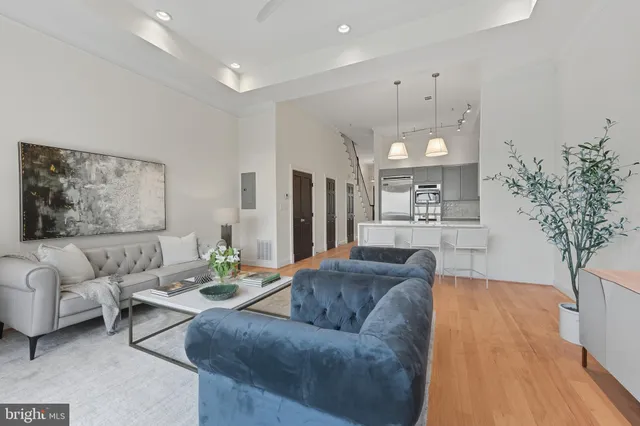 a view of a balcony with floor to ceiling windows with wooden floor
