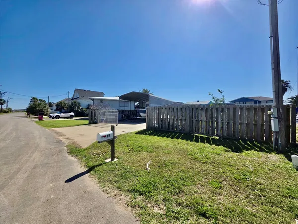 a house view with a backyard space