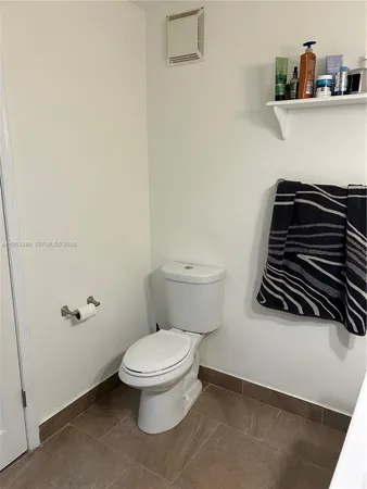 a bathroom with a toilet and a sink