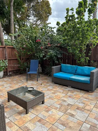 a bench sitting in the middle of a yard