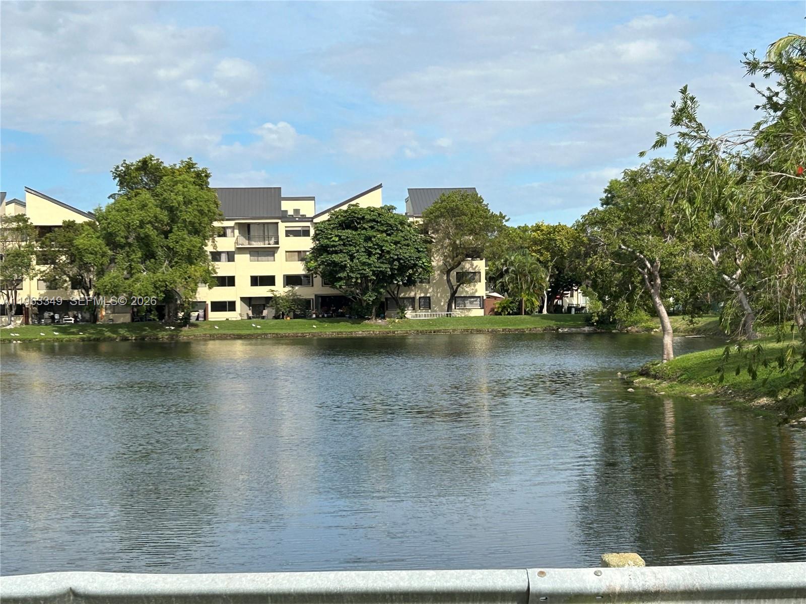 6619 Southwest 116th Place, Unit B7 Miami, FL 33173 - Photo 22 of 27 a view of a lake with houses
